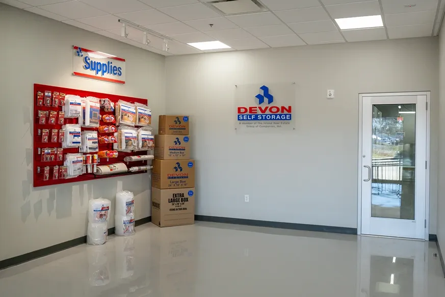 Devon Self Storage office interior with moving supplies including boxes, tape, and packing materials